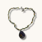 Teardrop resin pendant with a real white daisy flower on a stone beaded choker necklace with a silver toggle clasp