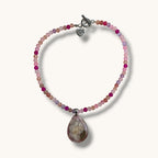 Teardrop resin pendant with a real white daisy flower on a pink beaded choker necklace with a silver toggle clasp
